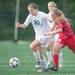 Father Gabriel Richard's Allison March drives the ball up field with Hanover-Horton's Chaney Manerin behind her during the first half of the regional semifinal game, Wednesday, May 29.
Courtney Sacco I AnnArbor.com  